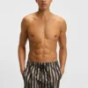 Quick-dry swim shorts with all-over print