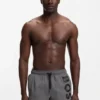 Quick-dry swim shorts with vertical logo print
