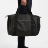 Reflective-detail holdall in faux leather
