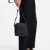 Reflective-detail reporter bag in faux leather Reflective-detail reporter bag in faux leather
