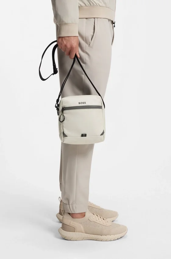 Reflective-detail reporter bag in faux leather Reflective-detail reporter bag in faux leather
