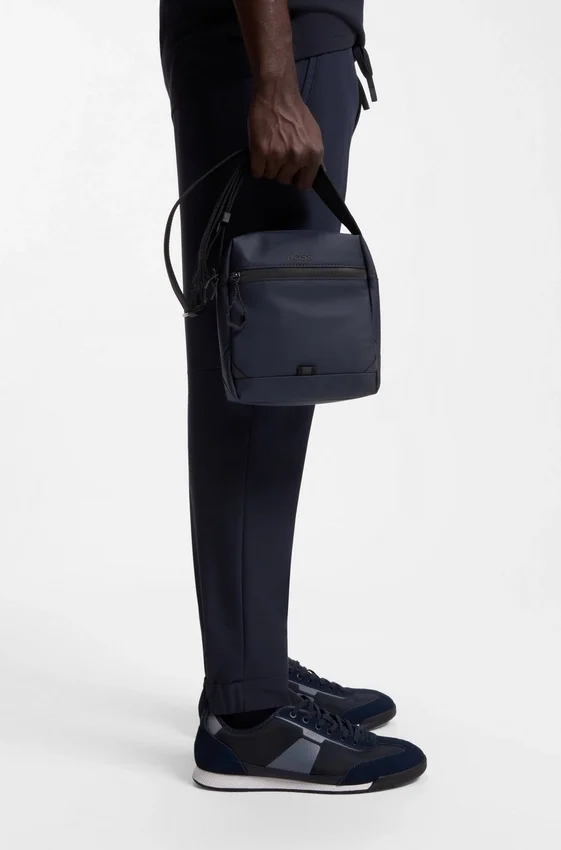 Reflective-detail reporter bag in faux leather Reflective-detail reporter bag in faux leather