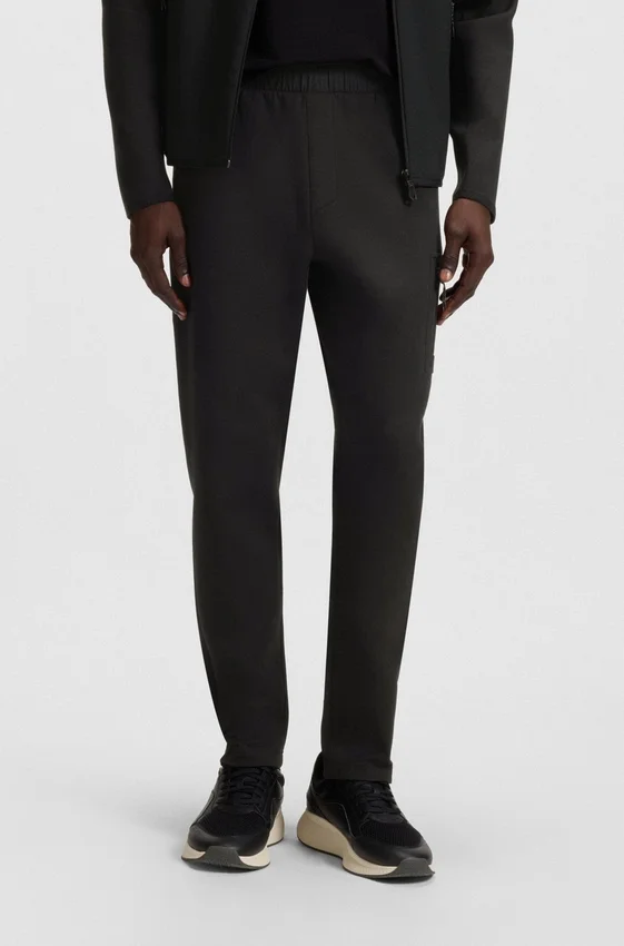 Regular-fit tracksuit bottoms with decorative reflective details Regular-fit tracksuit bottoms with decorative reflective details