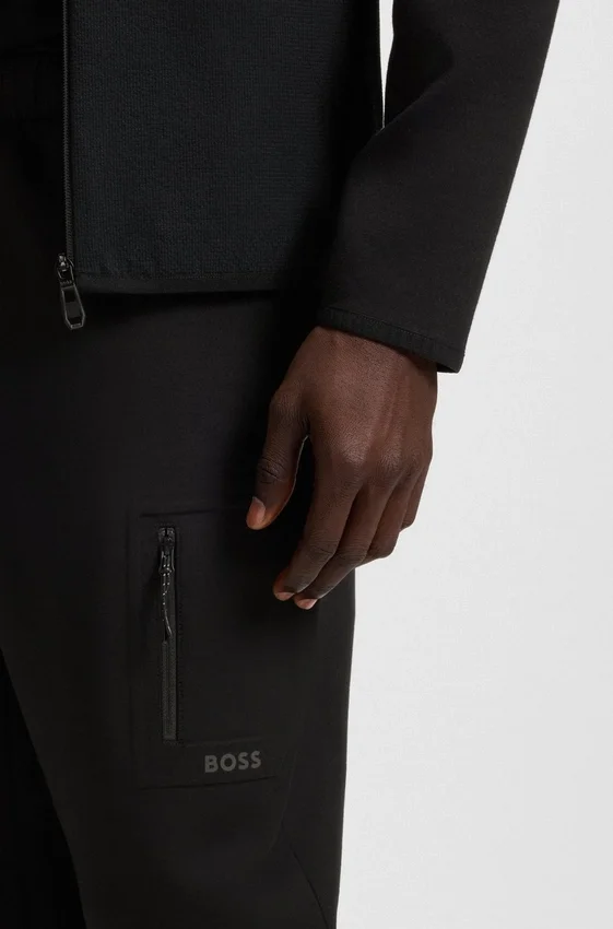 Regular-fit tracksuit bottoms with decorative reflective details Regular-fit tracksuit bottoms with decorative reflective details