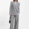 Relaxed-fit blazer with enamel flower brooch