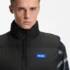 Relaxed-fit padded vest with logo badge