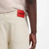 Relaxed-tapered-fit jeans in ecru denim
