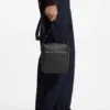 Reporter bag with embossed pattern