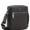 Reporter bag with embossed pattern