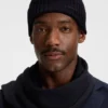 Rib-knit virgin-wool beanie with logo plaque