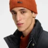 Rib-knit virgin-wool beanie with logo plaque