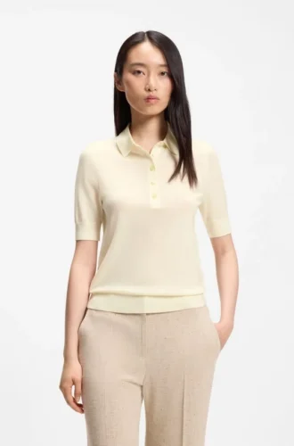 Short-sleeved sweater in merino wool with polo collar