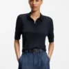 Short-sleeved sweater in merino wool with polo collar