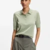 Short-sleeved sweater in merino wool with polo collar