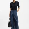 Short-sleeved sweater in merino wool with polo collar