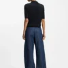 Short-sleeved sweater in merino wool with polo collar