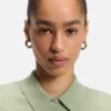 Short-sleeved sweater in merino wool with polo collar