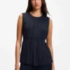 Sleeveless crepe blouse with pleats Sleeveless crepe blouse with pleats