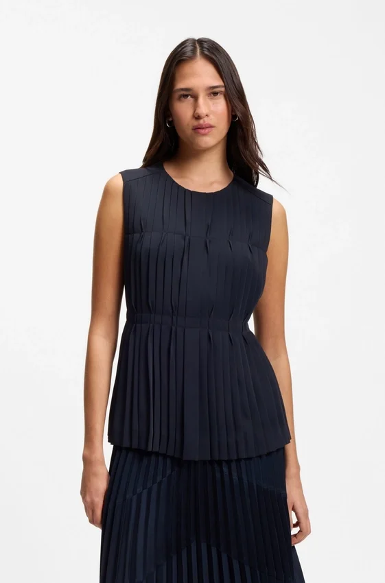 Sleeveless crepe blouse with pleats Sleeveless crepe blouse with pleats