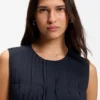 Sleeveless crepe blouse with pleats Sleeveless crepe blouse with pleats