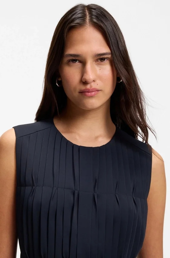 Sleeveless crepe blouse with pleats Sleeveless crepe blouse with pleats