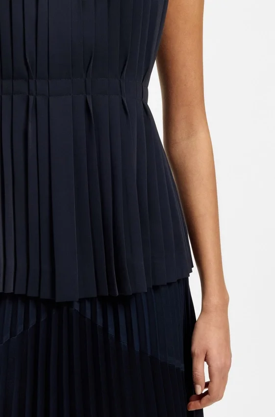 Sleeveless crepe blouse with pleats Sleeveless crepe blouse with pleats