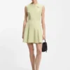 Sleeveless dress with gold-tone flower brooch Sleeveless dress with gold-tone flower brooch
