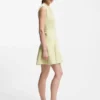 Sleeveless dress with gold-tone flower brooch Sleeveless dress with gold-tone flower brooch