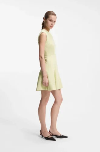 Sleeveless dress with gold-tone flower brooch