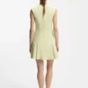 Sleeveless dress with gold-tone flower brooch Sleeveless dress with gold-tone flower brooch