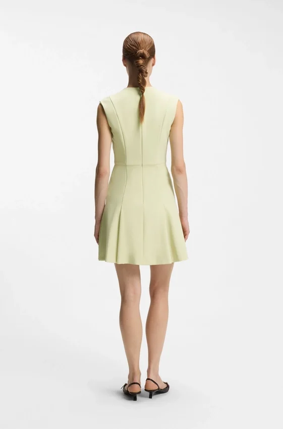 Sleeveless dress with gold-tone flower brooch Sleeveless dress with gold-tone flower brooch
