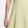 Sleeveless dress with gold-tone flower brooch Sleeveless dress with gold-tone flower brooch