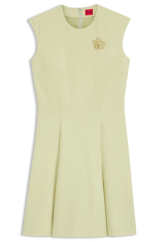 Sleeveless dress with gold-tone flower brooch Sleeveless dress with gold-tone flower brooch