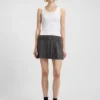 Sleeveless dress with pleated skirt