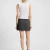 Sleeveless dress with pleated skirt