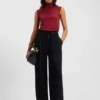 Sleeveless mock-neck sweater in merino wool