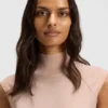 Sleeveless mock-neck sweater in merino wool