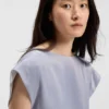 Slim-fit blouse with draped neckline Slim-fit blouse with draped neckline