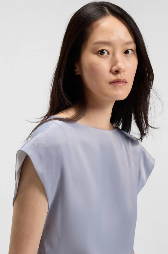 Slim-fit blouse with draped neckline Slim-fit blouse with draped neckline