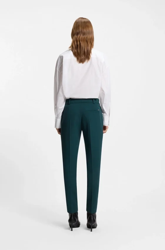 Slim-fit trousers with slit hems Slim-fit trousers with slit hems