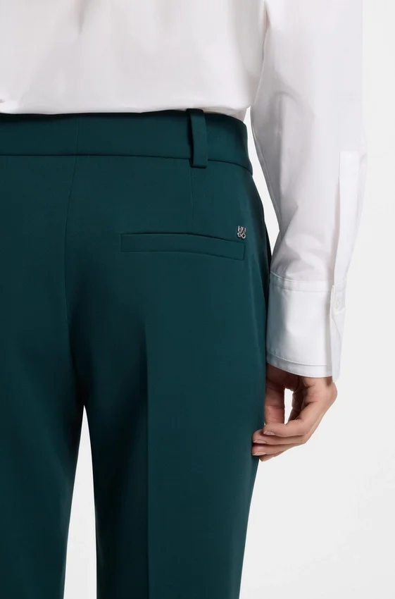 Slim-fit trousers with slit hems Slim-fit trousers with slit hems