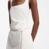 Square-neck dress with golden chain belt Square-neck dress with golden chain belt