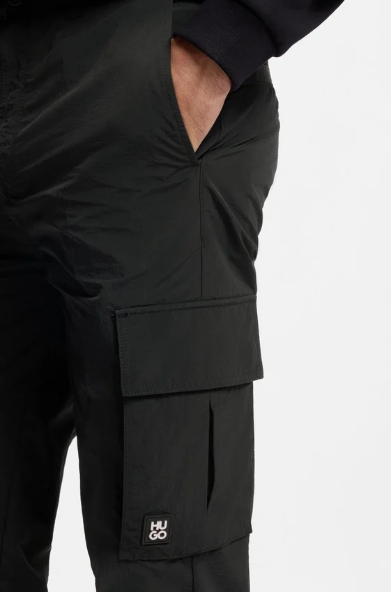 Straight-fit cargo trousers in waxed fabric Straight-fit cargo trousers in waxed fabric