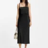 Strappy dress with laser-cut shapes Strappy dress with laser-cut shapes