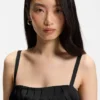Strappy dress with laser-cut shapes Strappy dress with laser-cut shapes