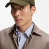 Suede cap with metal logo rivet Suede cap with metal logo rivet