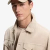 Suede cap with metal logo rivet Suede cap with metal logo rivet