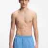 Swim shorts with all-over stacked logos