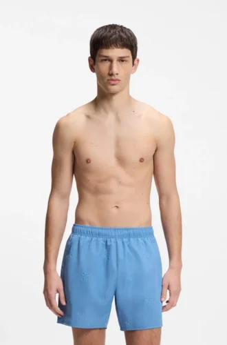 Swim shorts with all-over stacked logos