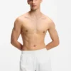 Swim shorts with all-over stacked logos